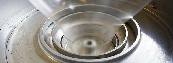 An employee demonstrates fast residue cleaning and easy screw pulls